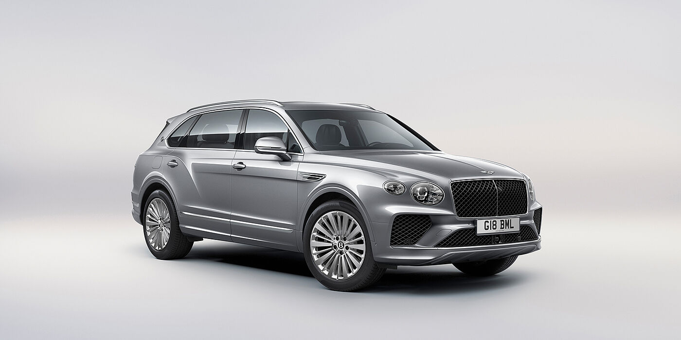 Bentley Al Khobar Bentley Bentayga Extended Wheelbase luxury SUV front three quarter view in Moonbeam paint with 21 inch five spoke painted wheels