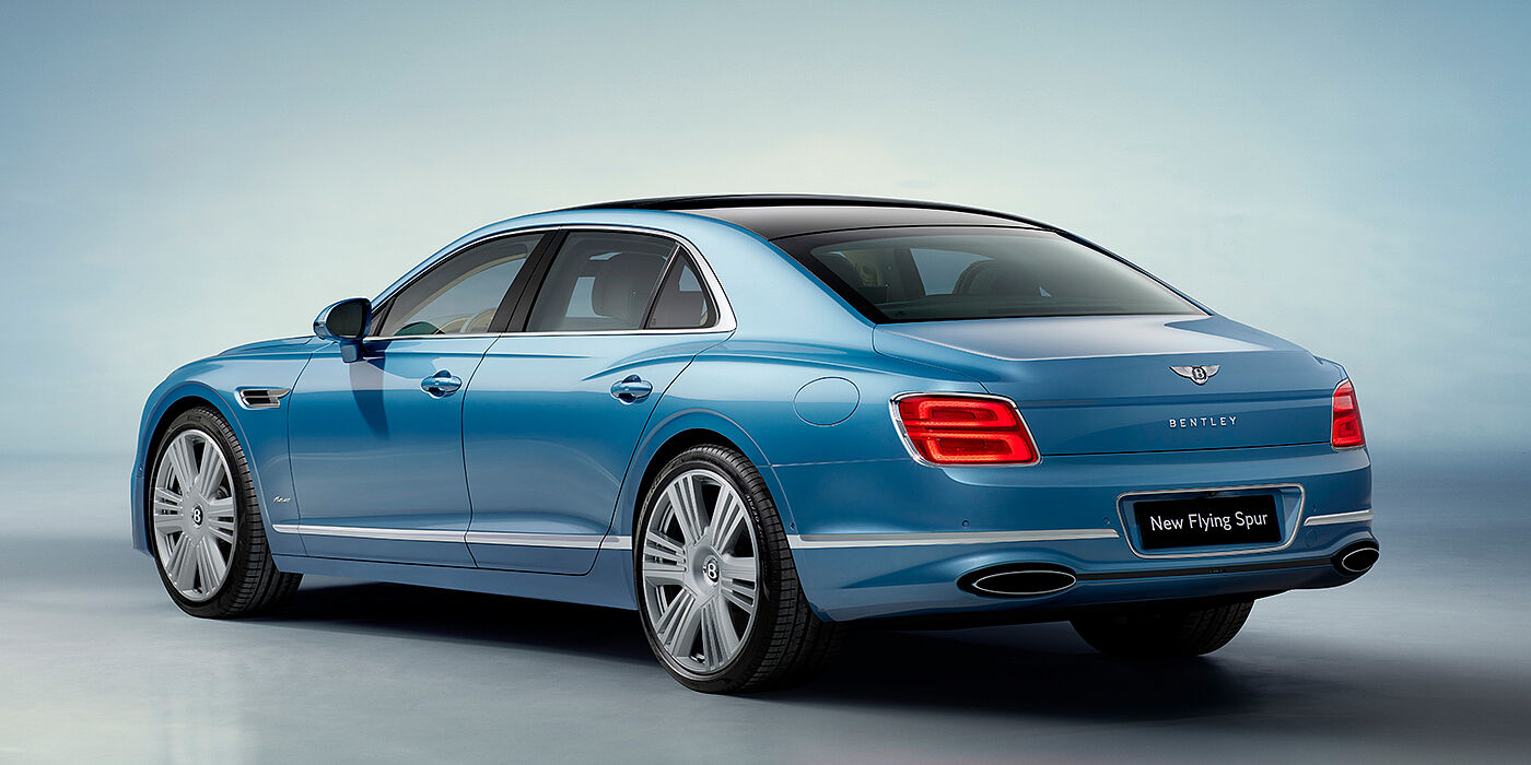 Bentley Al Khobar New Bentley Flying Spur Azure sedan rear view in Light windsor blue by Mulliner paint with 22 inch Azure wheels and chrome exterior details