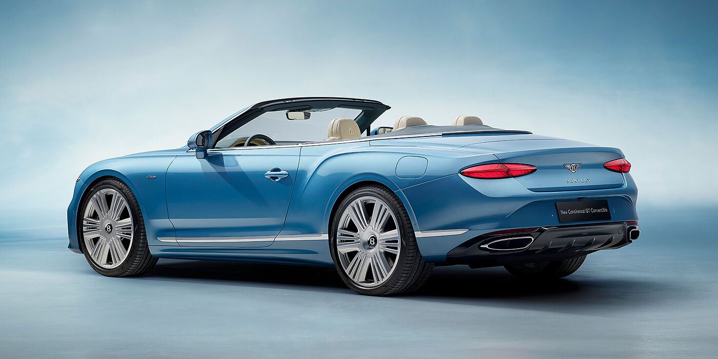 Bentley Al Khobar New Bentley Continental GTC Azure convertible rear view in Light Windsor blue paint with 22 inch ten spoke wheels and chrome exterior details