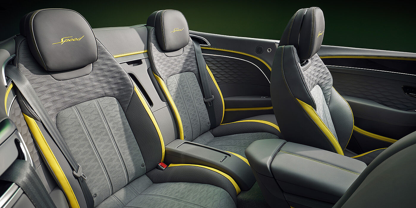 Bentley Al Khobar Bentley New Continental GTC Speed convertible rear interior with unique Speed colour split in Gravity Grey and Cyber Yellow hide colours, and contrast stitched headrest emblems 