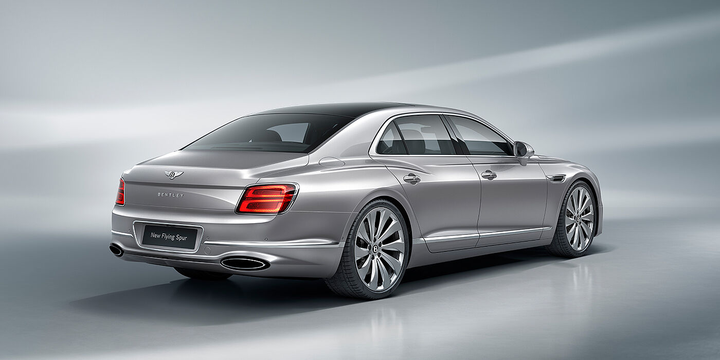 Bentley Al Khobar New Bentley Flying Spur sedan rear view in Silverlake paint with ten spoke wheels and chrome matrix grille