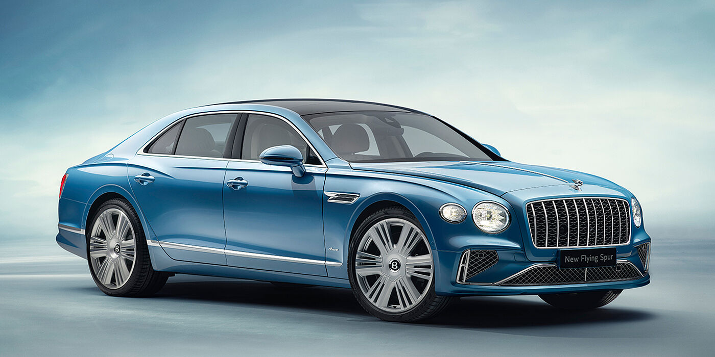 Bentley Al Khobar New Bentley Flying Spur Azure sedan front view in Light windsor blue by Mulliner paint with 22 inch Azure wheels and chrome exterior details