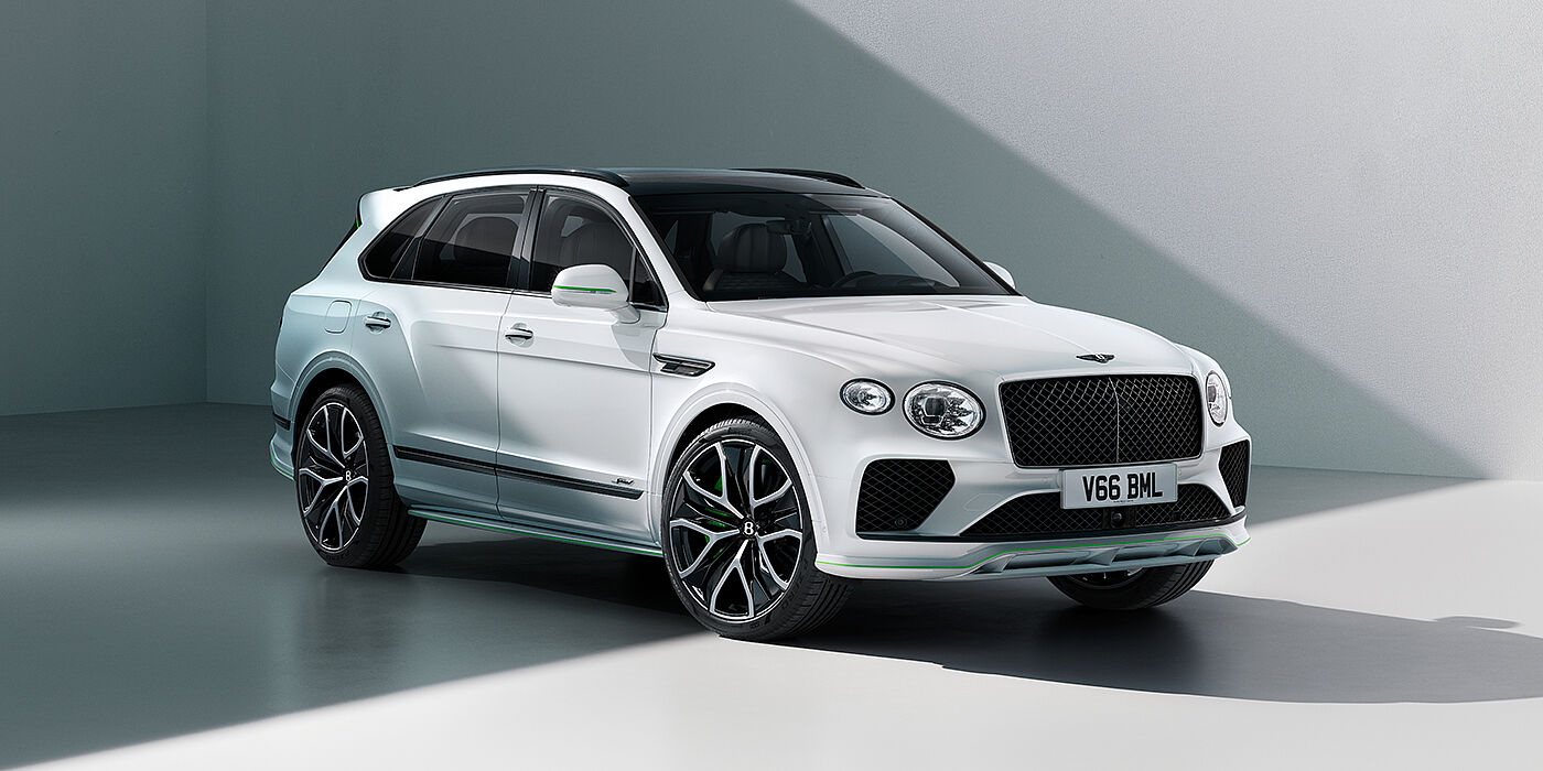 Bentley Al Khobar Bentley Bentayga Speed SUV front three quarter in Snow Quartz Pearlescent by Mulliner white paint against a grey wall