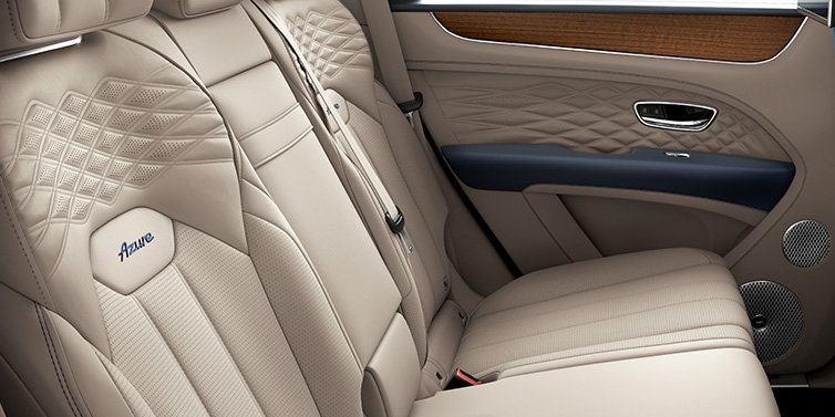 Bentley Al Khobar Bentley Bentayga Azure SUV rear interior in Portland and Imperial Blue hides and seat stitching featuring Azure seat emblem