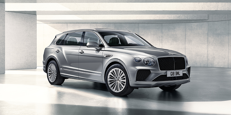 Bentley Al Khobar Bentley Bentayga Extended Wheelbase SUV front three quarter in Moonbeam paint with a grey background