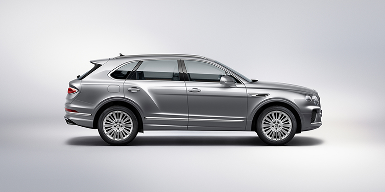 Bentley Al Khobar Bentley Bentayga SUV side profile in Moonbeam silver paint against white background featuring 21 inch 5 spoke wheels