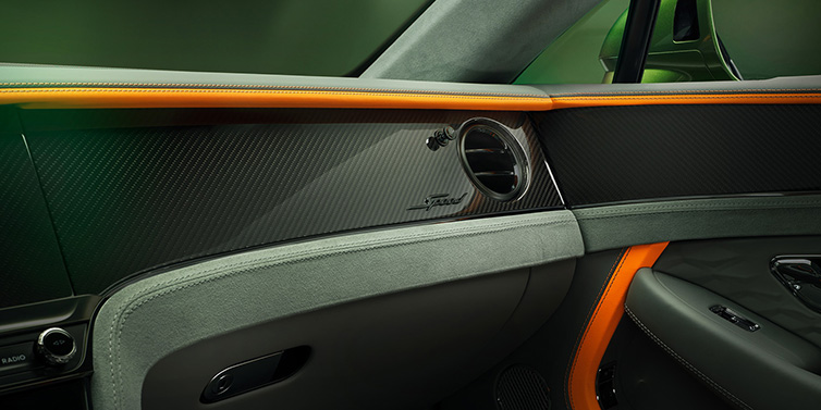 Bentley Al Khobar Bentley Continental GT Speed coupe front interior dash detail with high gloss carbon fibre veneer surrounded by Mandarin by Mulliner and Gravity Grey hides