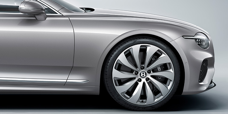Bentley Al Khobar New Bentley Continental GT coupe side view featuring bonnet in Silverlake paint and 22 inch ten spoke silver painted and bright machined wheel