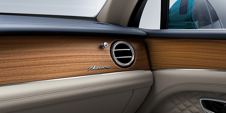 Bentley Al Khobar Bentley Bentayga Extended Wheelbase Azure front dash showing Open Pore Koa veneer surrounded by Portland and Imperial Blue hides