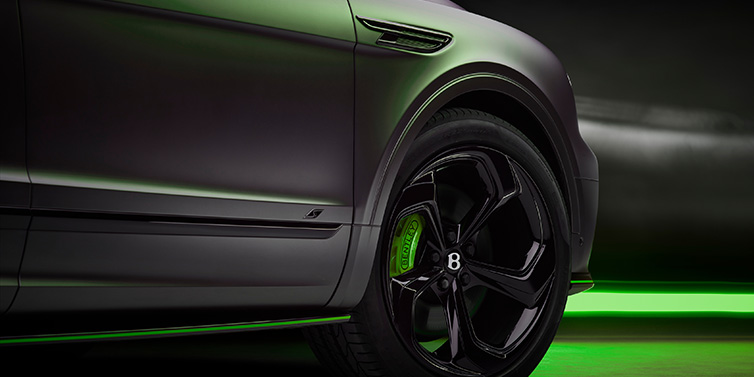 Bentley Al Khobar Bentley Bentayga S Black Edition SUV exterior wheel detail with Cyber Green brakes with Anthracite Satin paint