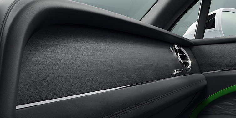 Bentley Al Khobar Bentley Bentayga Speed SUV front dash close up in Hyper Green and Beluga black hides, with Black Stained Crown Cut Walnut veneer