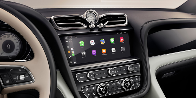 Bentley Al Khobar Bentley Bentayga Extended Wheelbase Mulliner SUV front interior centre console with MMI screen showing Apps surrounded by Linen and Beluga black hide