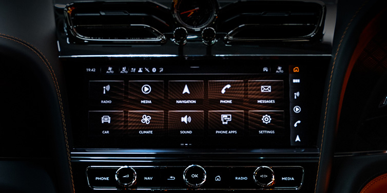 Bentley Al Khobar Bentley Bentayga S Black Edition SUV front interior console with MMI screen featuring driver options surrounded by dark hide