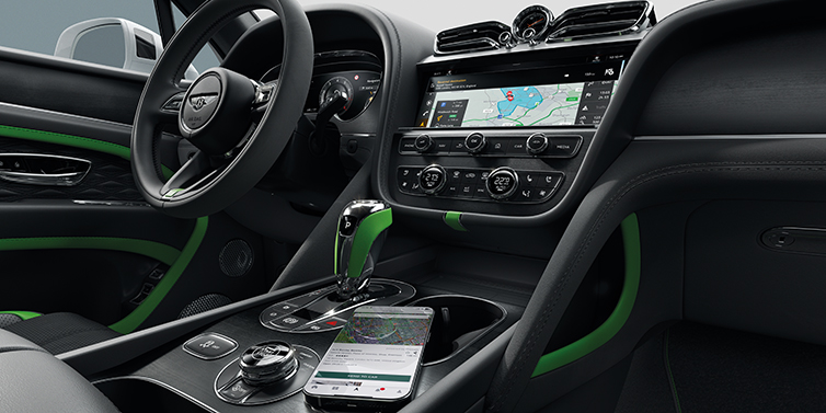 Bentley Al Khobar Bentley Bentayga Speed SUV front cabin in Hyper Green and Beluga black hides, with Black Stained Crown Cut Walnut veneer