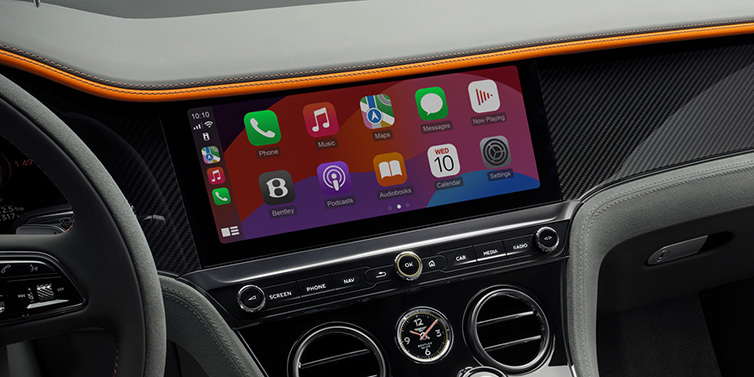 Bentley Al Khobar Bentley Continental GT Speed coupe front interior centre console with MMI screen featuring Apps surrounded by Mandarin by Mulliner and Gravity Grey hides