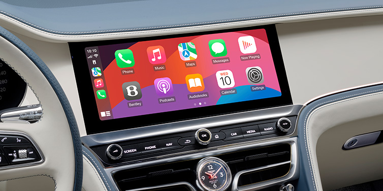Bentley Al Khobar New Bentley Flying Spur Azure sedan front cabin central MMI screen showing available services against Linen and Brunel hides and Piano Linen veneer