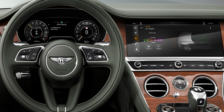 Bentley Al Khobar New Bentley Continental GTC convertible front interior steering wheel view, with Beluga black leather and Crown Cut walnut veneer